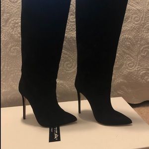 Black tall suede leather boots.